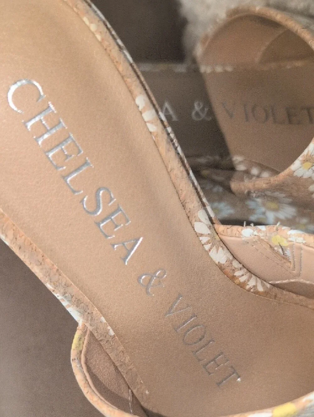 Chelsea & Violet daisy-patterned cork wedge heel.